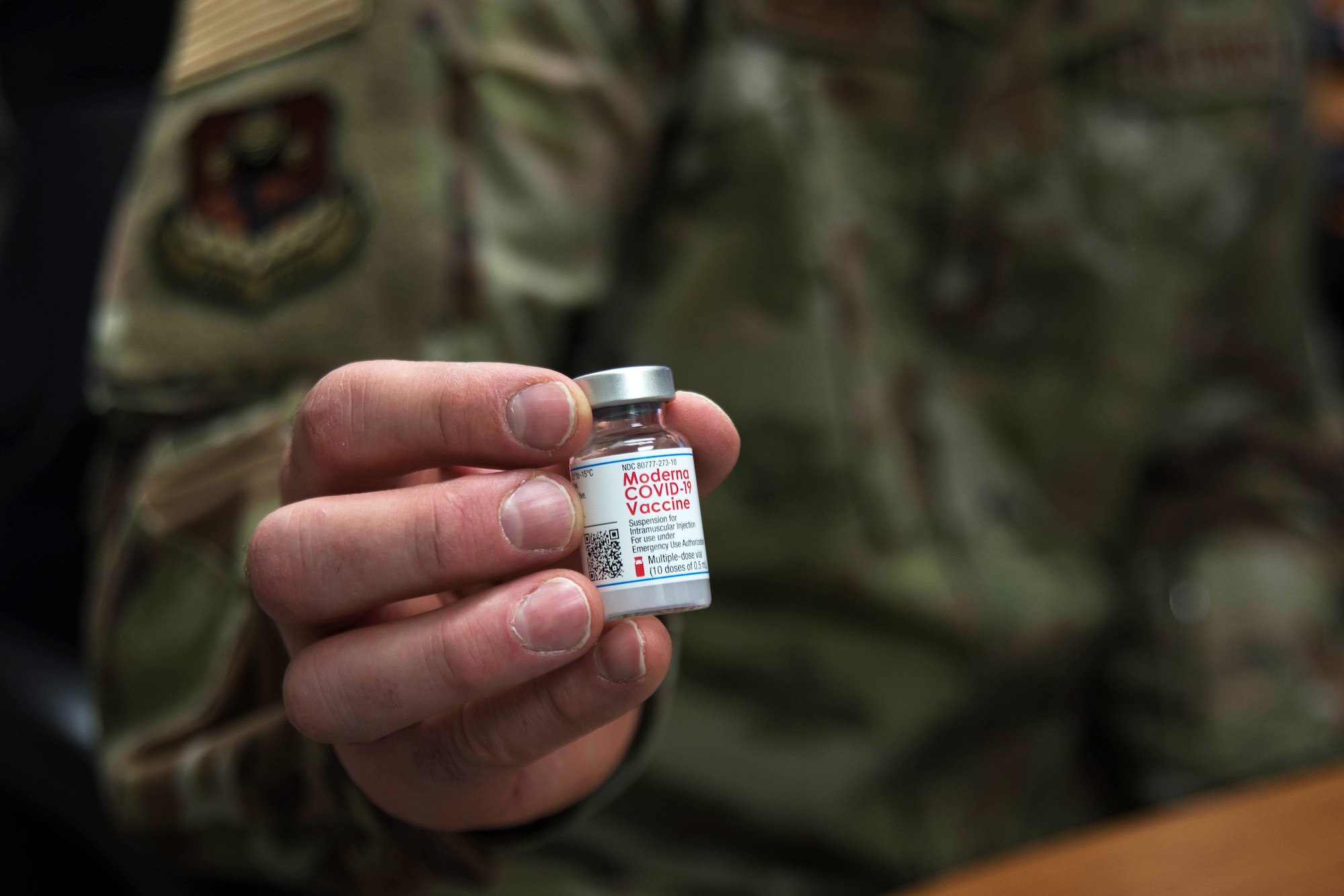 A U.S. Air Force Medic assigned to the 178th Medical Group holds the COVID-19 vaccination.