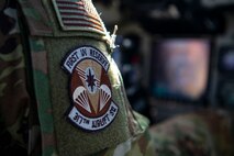A pilot from the 317th Airlift Squadron adjusts controls in a C-17 Globemaster III over the Atlantic Ocean, Jan. 15, 2021.