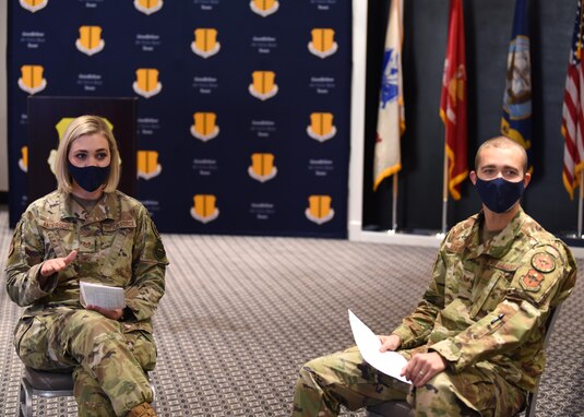 U.S. Air Force Tech. Sgt. Patricia Anderson, and Tech. Sgt. Mike Lowry, 315th Training Squadron instructors, welcome the audience to the first commander’s all call of 2021, at the Event Center on Goodfellow Air Force Base, Texas, Jan. 15, 2021. Anderson and Lowry entertained the audience as they arrived before leadership arrived. (U.S. Air Force photo by Airman 1st Class Ethan Sherwood)