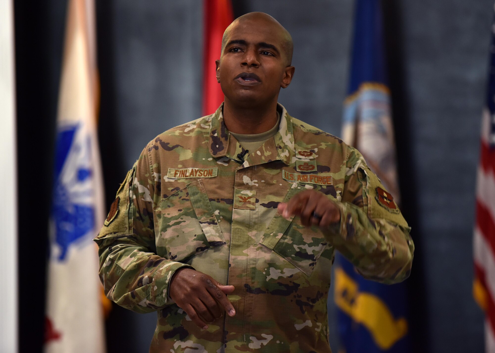 U.S. Air Force Col. James Finlayson, 17th Training Wing vice commander, addresses audience members over a virtual video call and in person at the first commander’s call of 2021, at the Event Center on Goodfellow Air Force Base, Texas, Jan. 15, 2021. Finlayson spoke about the Accelerate portion of the new focus Accelerate, Challenge and Thrive. (U.S. Air Force photo by Staff Sgt. Seraiah Wolf)