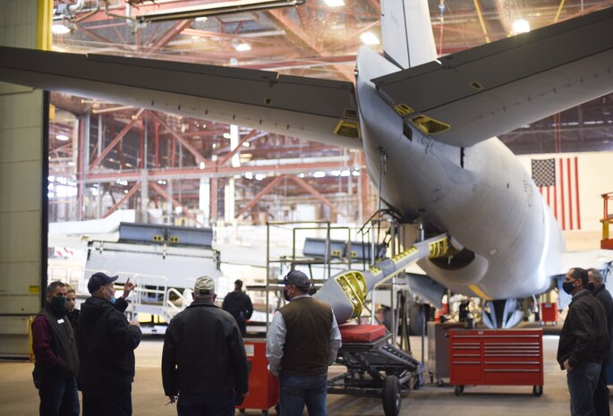 Man shows people a plane