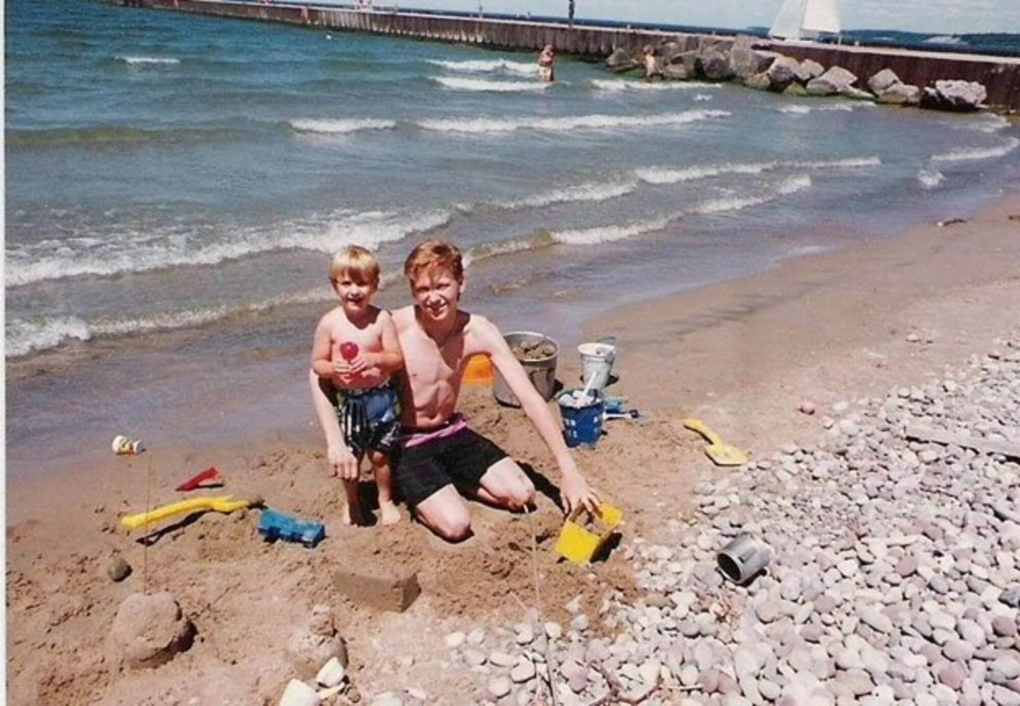 Picture of Capt. Ronald J. Miller as a young boy with his older brother, Mike, at the beach.