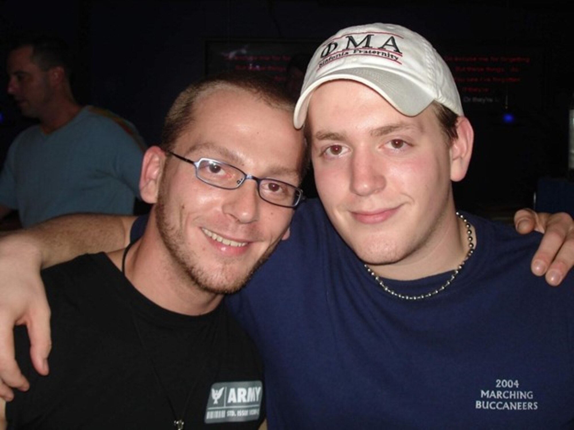 Picture of two young men - Capt. Ronald J. Miller and his brother Mike Miller - with their arms around each other's shoulders.