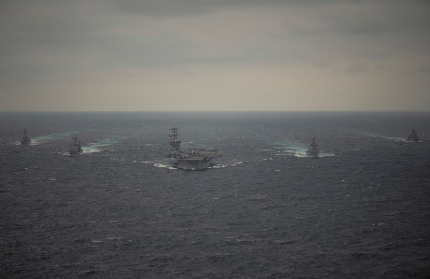 PACIFIC OCEAN (Jan. 15, 2021) – The Arleigh Burke-class guided-missile destroyer USS John Finn (DDG 113), left, Ticonderoga-class guided-missile cruiser USS Bunker Hill (CG 52), left center, the aircraft carrier USS Theodore Roosevelt (CVN 71), center, Japan Maritime Self-Defense Force Kongo-class guided-missile destroyer JS Kongo (DDG 173), right center, and JMSDF Asahi-class destroyer JS Asahi (DD 119) transit the Pacific Ocean Jan. 15, 2021. The Theodore Roosevelt Carrier Strike Group is on a scheduled deployment to the U.S. 7th Fleet area of operations. As the U.S. Navy's largest forward deployed fleet, with its approximate 50-70 ships and submarines, 140 aircraft, and 20,000 Sailors in the area of operations at any given time, 7th Fleet conducts forward-deployed naval operations in support of U.S. national interests throughout a free and open Indo-Pacific area of operations to foster maritime security, promote stability, and prevent conflict alongside 35 other maritime nations and partners. (U.S. Navy photo by Mass Communication Specialist 3rd Class Brandon Richardson)