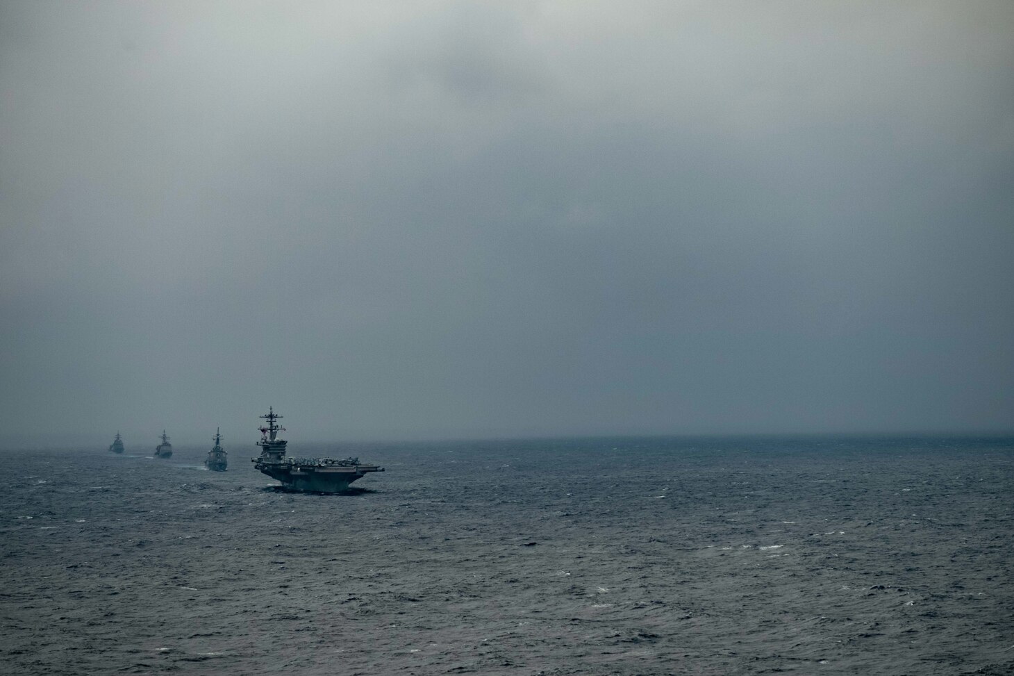 PACIFIC OCEAN (Jan. 15, 2021) – The aircraft carrier USS Theodore Roosevelt (CVN 71), front, Japan Maritime Self-Defense Force (JMSDF) Kongo-class guided-missile destroyer JS Kongo (DDG 173), Ticonderoga-class guided-missile cruiser USS Bunker Hill (CG 52), and JMSDF Asahi-class destroyer JS Asahi (DD 119) transit the Pacific Ocean Jan. 15, 2021. The Theodore Roosevelt Carrier Strike Group is on a scheduled deployment to the U.S. 7th Fleet area of operations. As the U.S. Navy's largest forward deployed fleet, with its approximate 50-70 ships and submarines, 140 aircraft, and 20,000 Sailors in the area of operations at any given time, 7th Fleet conducts forward-deployed naval operations in support of U.S. national interests throughout a free and open Indo-Pacific area of operations to foster maritime security, promote stability, and prevent conflict alongside 35 other maritime nations and partners. (U.S. Navy photo by Mass Communication Specialist 3rd Class Brandon Richardson)