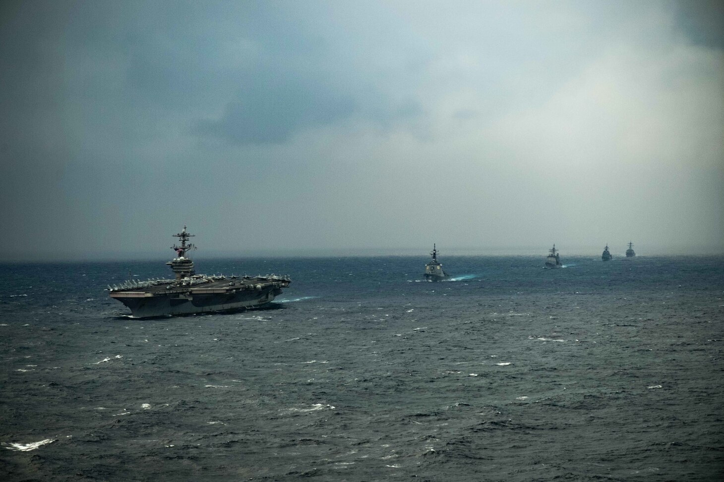 PACIFIC OCEAN (Jan. 15, 2021) – The aircraft carrier USS Theodore Roosevelt (CVN 71), front, Japan Maritime Self-Defense Force (JMSDF) Kongo-class guided-missile destroyer JS Kongo (DDG 173), Ticonderoga-class guided-missile cruiser USS Bunker Hill (CG 52), JMSDF Asahi-class destroyer JS Asahi (DD 119), and Arleigh Burke-class guided-missile destroyer USS John Finn (DDG 113) transit the Pacific Ocean Jan. 15, 2021. The Theodore Roosevelt Carrier Strike Group is on a scheduled deployment to the U.S. 7th Fleet area of operations. As the U.S. Navy's largest forward deployed fleet, with its approximate 50-70 ships and submarines, 140 aircraft, and 20,000 Sailors in the area of operations at any given time, 7th Fleet conducts forward-deployed naval operations in support of U.S. national interests throughout a free and open Indo-Pacific area of operations to foster maritime security, promote stability, and prevent conflict alongside 35 other maritime nations and partners. (U.S. Navy photo by Mass Communication Specialist 3rd Class Brandon Richardson)