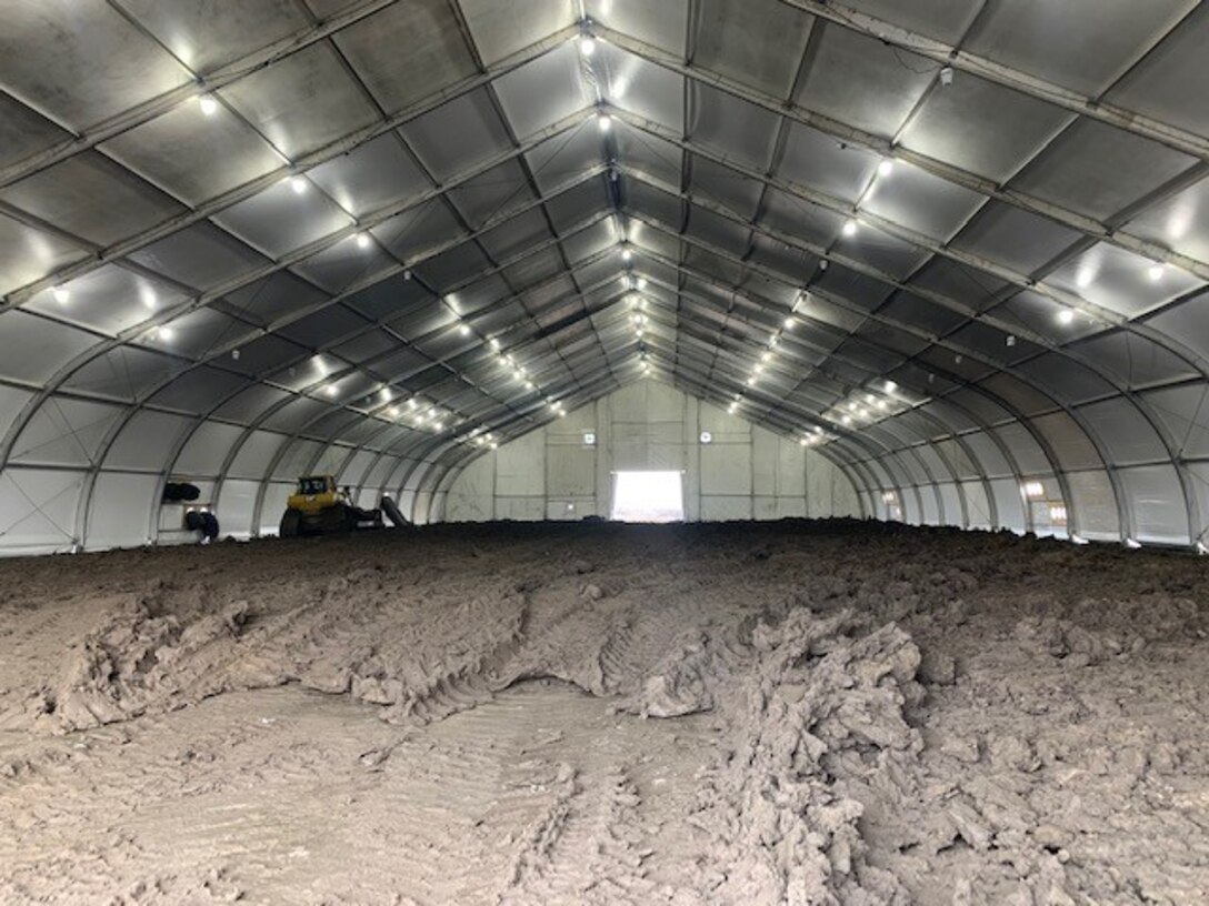 Eight heated tents to condition cohesive material so it can be placed along the levee setback alignment are being used on the L-536 levee system just south of Rock Port, Mo..