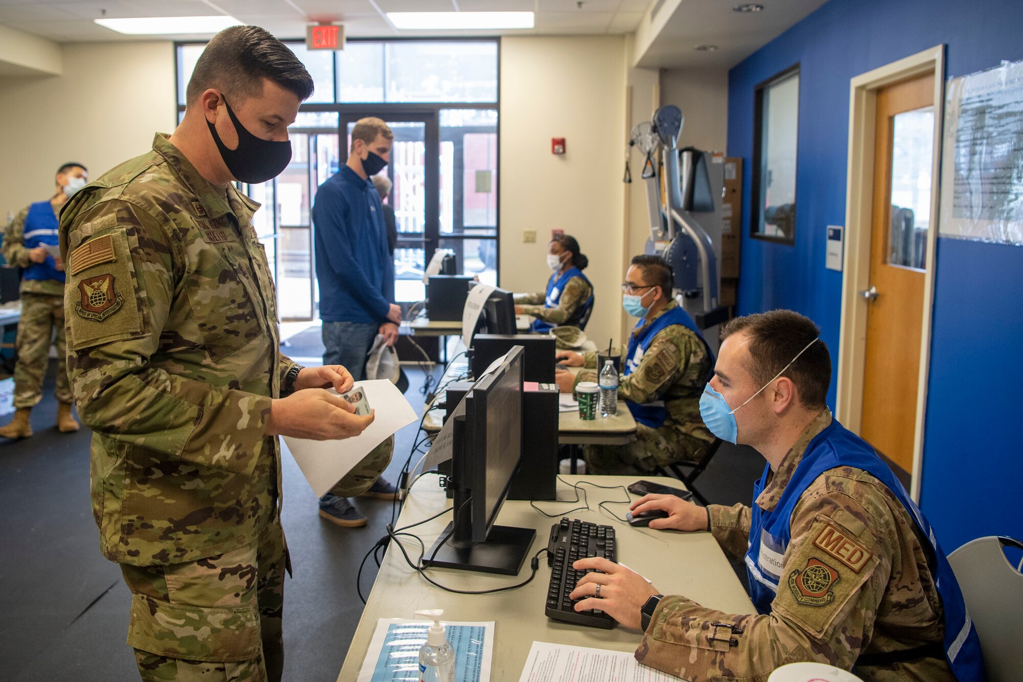 An Airman talks to a medical technician.