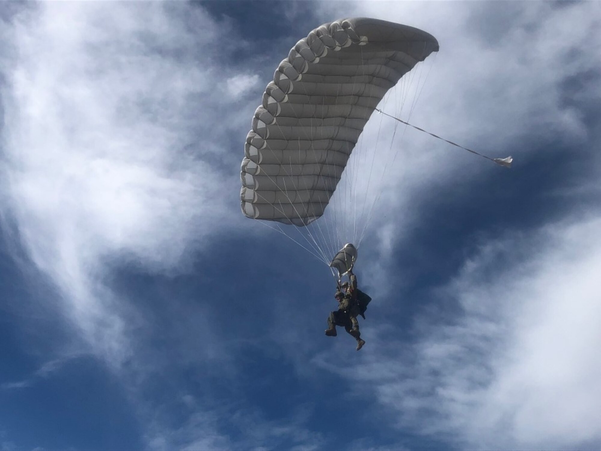 U. S. Marine Corps Staff Sgt. Patrick Doody, 4th Reconnaissance Battalion paraloft chief, Marine Forces Reserve, and U. S. Air Force Lt. Denise Johnson, aerospace physiologist assigned to the 12th Operations Support Squadron, complete a tandem freefall jump training exercise at South Texas Regional Airport, Hondo, Texas, Dec. 11, 2020.