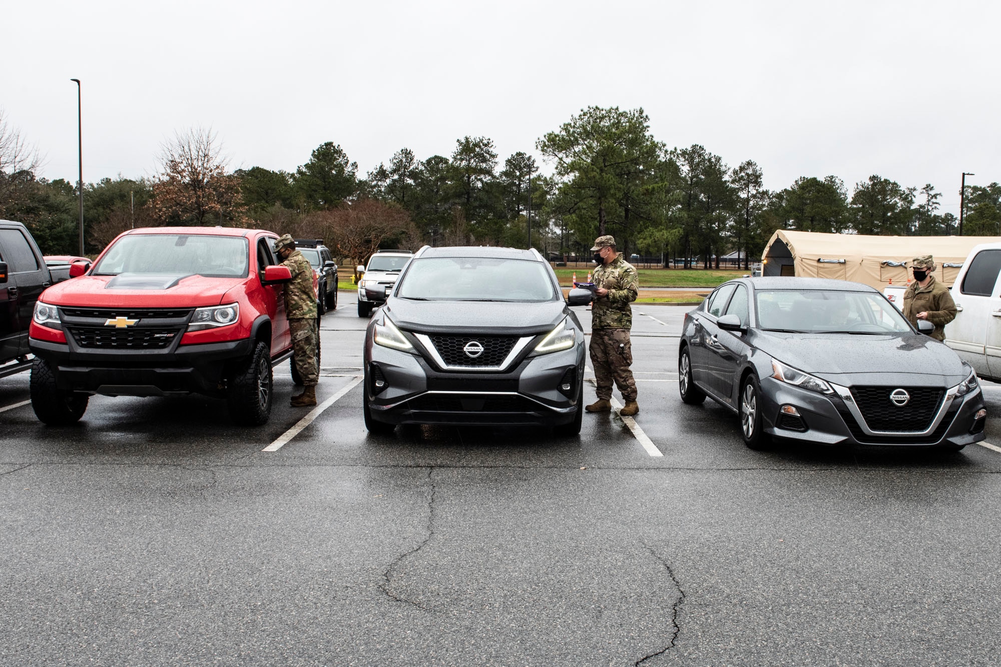 Airmen screening patients in vehicles.