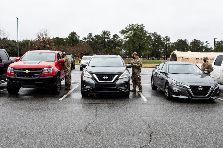 Airmen screening patients in vehicles.
