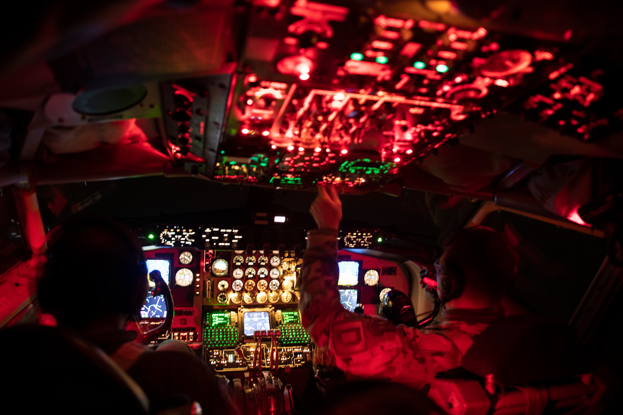 U.S. Air Force Capt. Joseph Tomassi, 351st Air Refueling Squadron pilot, left, and Lt. Col. Tyler Berge, 100th Operational Support Squadron director of operations, prepare a KC-135 Stratotanker for a flight supporting a Black Sea mission at RAF Mildenhall, United Kingdom, Jan. 14, 2021. U.S. military operations over the Black Sea enhance regional stability, combined readiness and capability with NATO allies and partners.