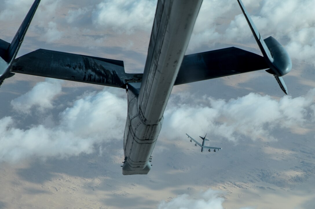 A U.S. Air Force B-52 Stratofortress assigned to the 5th Bomb Wing departs after receiving fuel from a KC-10 Extender assigned to the 908th Expeditionary Air Refueling Squadron during a Bomber Task Force (BTF) mission over the U.S. Central Command area of responsibility, Jan. 17, 2021. The B-52 is a long range bomber with a range of approximately 8,800 miles, enabling rapid support of BTF missions or deployments and reinforcing global security and stability. (U.S. Air Force photo by Senior Airman Aaron Larue Guerrisky)