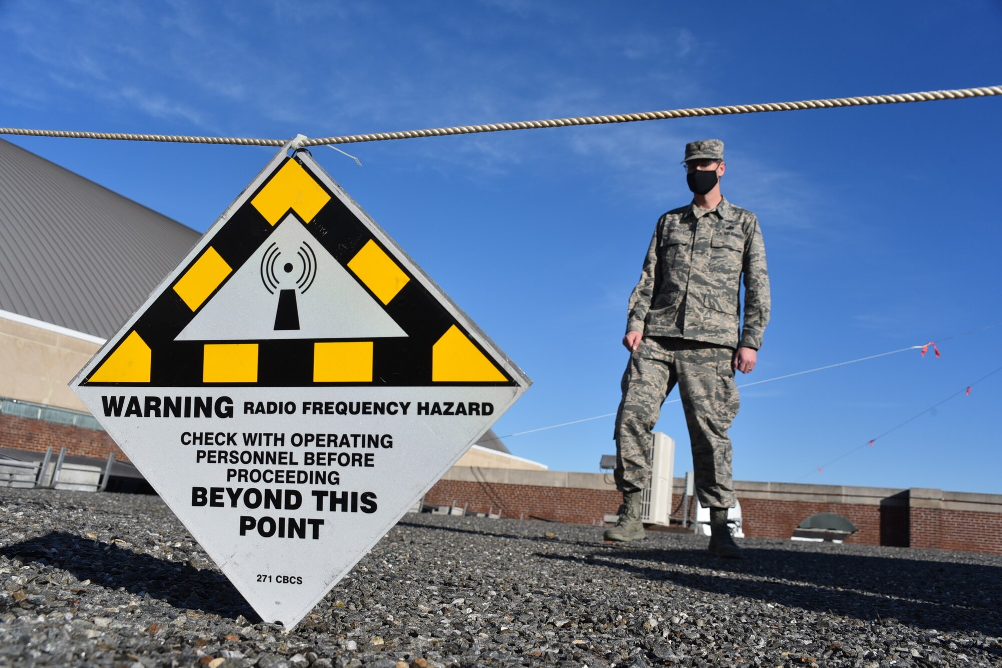 1st Lt Howard Chattley of the 111th Attack Wing Communications Flight, Pennsylvania Air National Guard, from Horsham Air Guard Station, Pa., sets up a safe RF Hazard perimeter while setting up satellite communications equipment on Jan. 10, 2021, in Washington, D.C., while supporting Operation Capitol Response-PA.