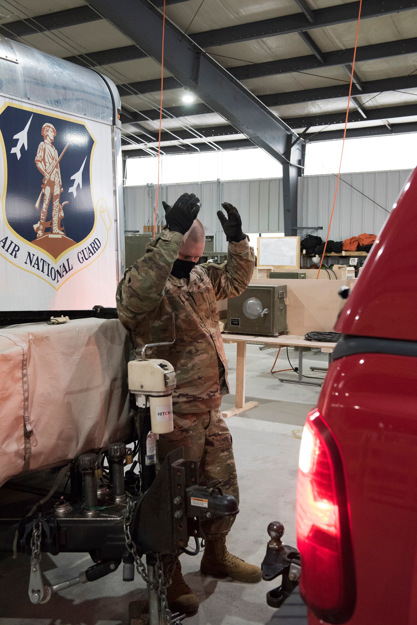 Tech. Sgt. Michael Lengle hooks up the Disaster Relief Mobile Kitchen Trailer to a vehicle in preparation to support service members in the D.C. area for the 59th Presidential Inauguration