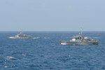 PACIFIC OCEAN (Jan. 9, 2021) The Federated States of Micronesia (FSM) National Police Maritime Surveillance Division Patrol Boats FSS Palikir and FSS Micronesia transit alongside the Arleigh Burke-class guided-missile destroyer USS Russell (DDG 59) Jan. 9, 2021. Russell, part of the Theodore Roosevelt Carrier Strike Group, is on a scheduled deployment to the U.S. 7th Fleet area of operations. As the U.S. Navy’s largest forward deployed fleet, with its approximate 50-70 ships and submarines, 140 aircraft, and 20,000 Sailors in the area of operations at any given time, 7th Fleet conducts forward-deployed naval operations in support of U.S. national interests throughout a free and open Indo-Pacific area of operations to foster maritime security, promote stability, and prevent conflict alongside 35 other maritime nations and partners. (U.S. Navy photo by Mass Communication Specialist 3rd Class Wade Costin)