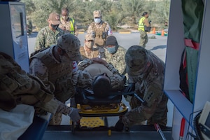 210113-N-KZ419-1386 U.S. 5TH FLEET AREA OF OPERATIONS (Jan. 13, 2021) Bahrain Defense Force and U.S. Naval Forces Central Command personnel transport a simulated medical casualty during in a joint anti-terrorism and mass casualty exercise in the U.S. 5th Fleet Area of Operations, Jan. 13. The bilateral exercise focused on enhancing mutual security and anti-terrorism capabilities by testing responses to simulated scenarios.  (U.S. Navy photo by Mass Communication Specialist 3rd Class Dawson Roth)