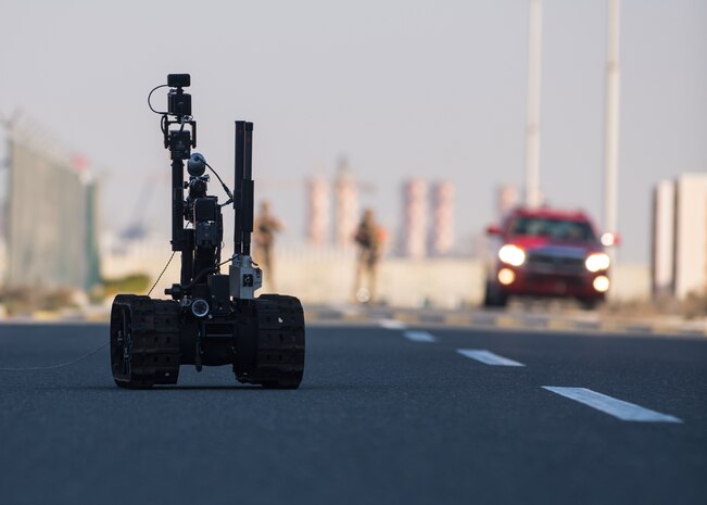 210113-N-KZ419-1087 U.S. 5TH FLEET AREA OF OPERATIONS (Jan. 13, 2021) Bahrain Defense Force explosive ordnance disposal technicians control a robot to investigate a simulated improvised explosive device during a joint anti-terrorism exercise with U.S. Naval Forces Central Command in the U.S. 5th Fleet area of operations, Jan. 13. The bilateral exercise focused on enhancing mutual security and anti-terrorism capabilities by testing responses to simulated scenarios. (U.S. Navy photo by Mass Communication Specialist Dawson 3rd Class Roth)