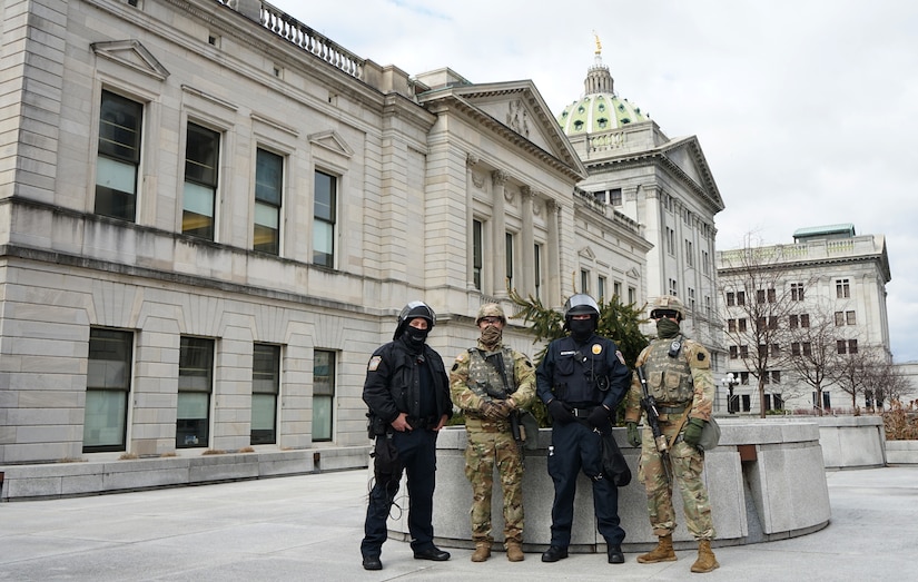 Pennsylvania National Guard and Capitol Police stand ready to defend their position at the state capitol in Harrisburg, Pa., on Jan. 17, 2021.