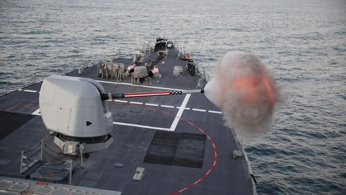 210114-N-BM428-0017 ATLANTIC OCEAN (Jan. 14, 2021) The Arleigh Burke-class guided-missile destroyer USS Porter (DDG 78) fires its Mark 45 5-inch gun during a live-fire exercise portion of Exercise Atlas Handshake in the Atlantic Ocean, Jan. 14, 2021. Porter, forward deployed to Rota, Spain, is on its ninth patrol in the U.S. 6th fleet area of operations in support of U.S. national security interests in Europe and Africa. (U.S. Navy photo by Mass Communication Specialist 2nd Class Damon Grosvenor