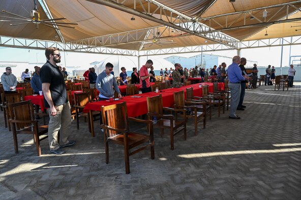 Worshippers stand to pray during a Dr. Martin Luther King, Jr. unity service at Al Dhafra Air Base, United Arab Emirates, Jan. 17, 2021.