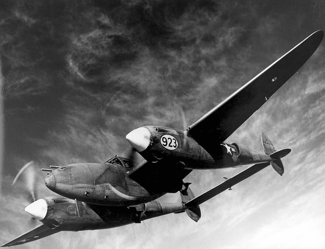 1940's -- Barely visible beneath the wings of a Lockheed P-38 Lightning are the deadly bombs with which this multi-purpose plane can blast enemy troops, ships and gun emplacements. At the Army Air Forces Tactical Center in Orlando, Fla., the P-38 demonstrated its ability to carry bomb payloads up to 2,000 pounds. (U.S. Air Force photo)