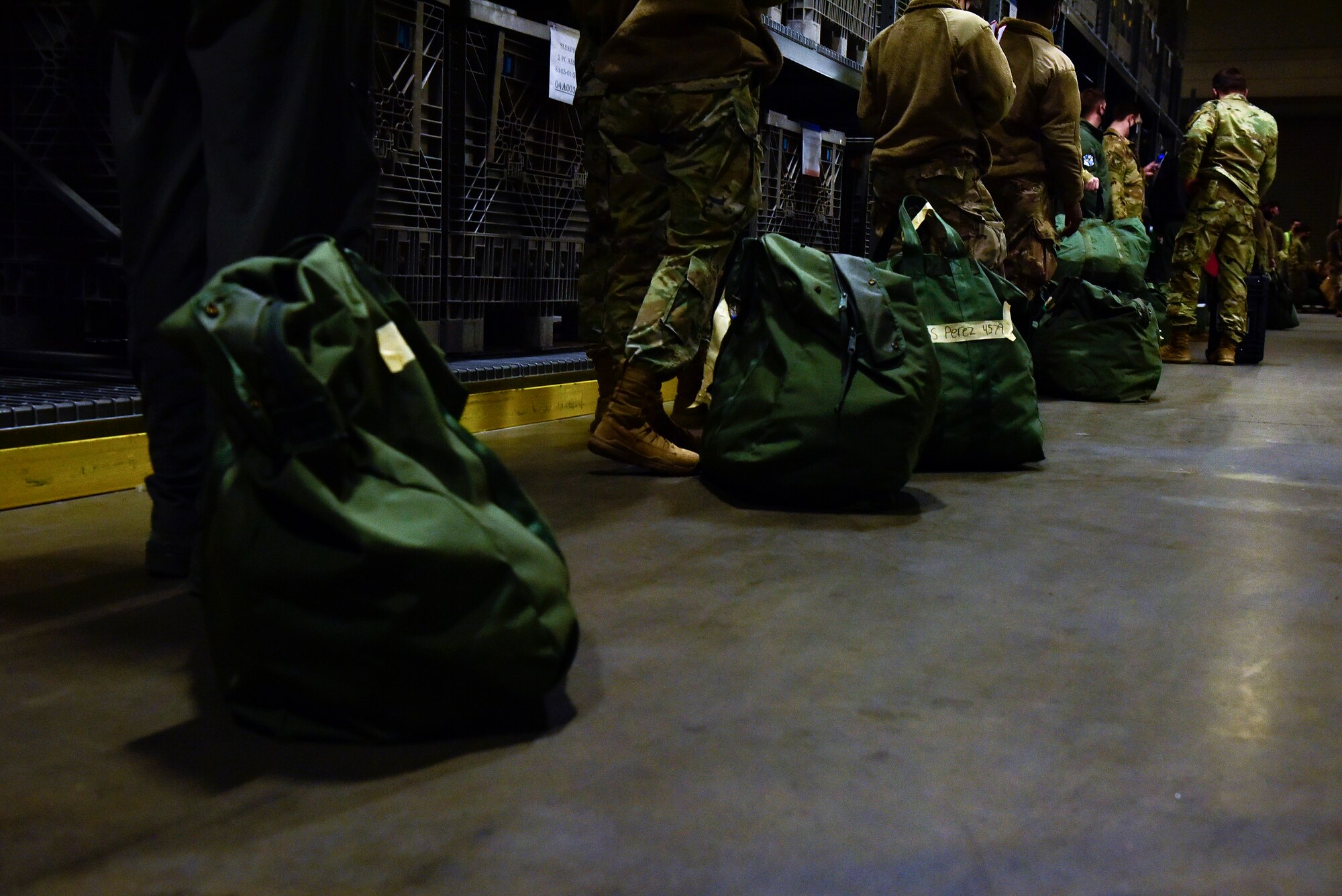 A group of people wait in line