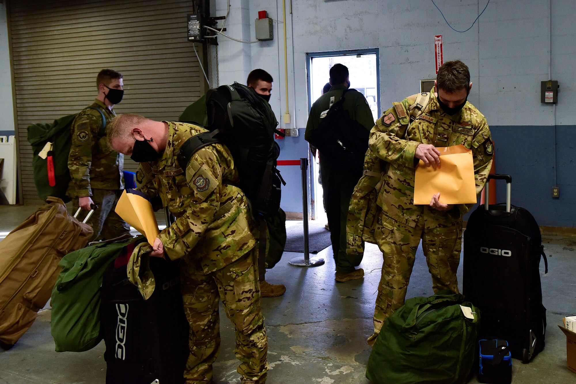 A group of people check their paperwork