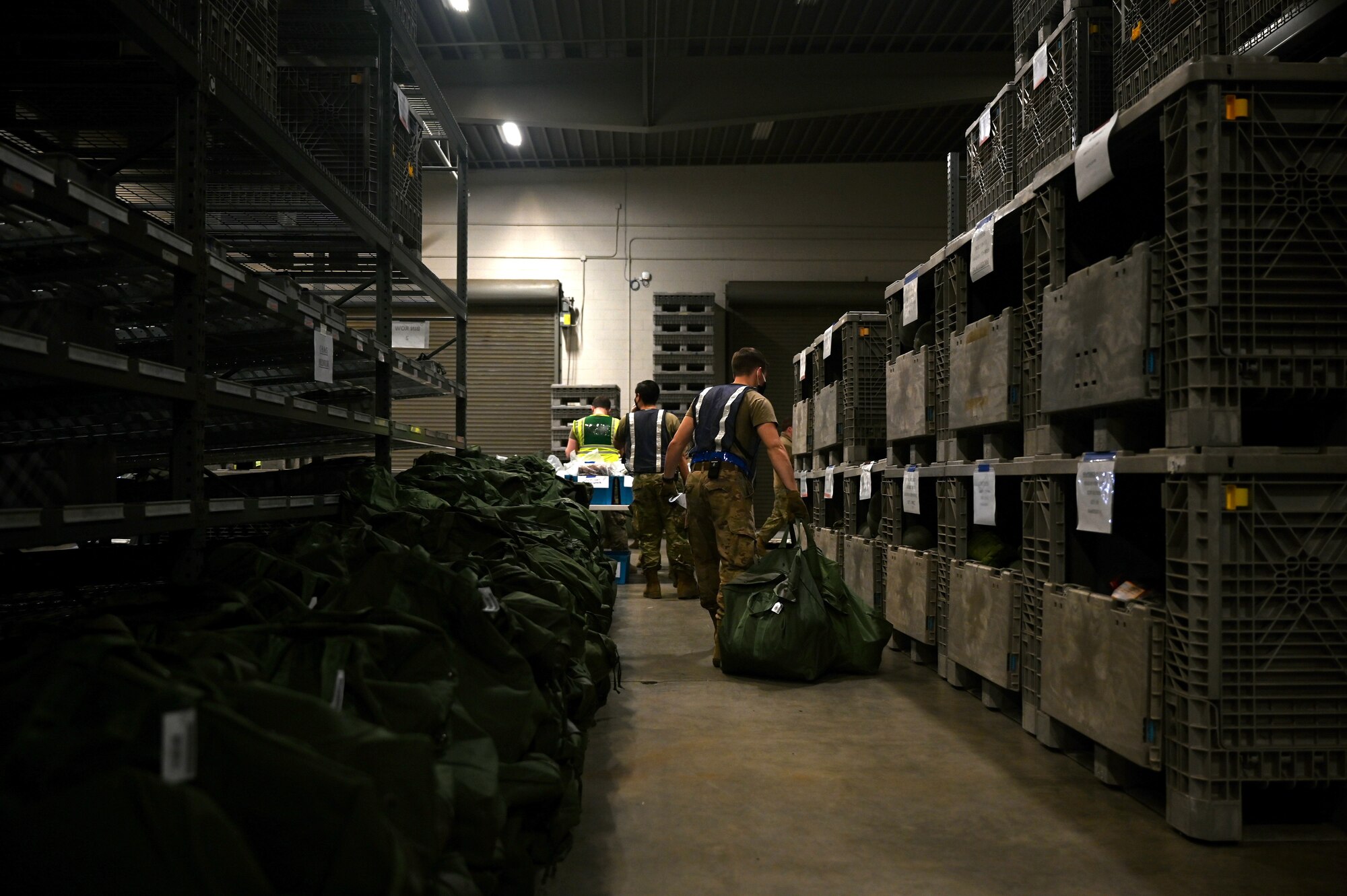 People retrieve gear to be issued out