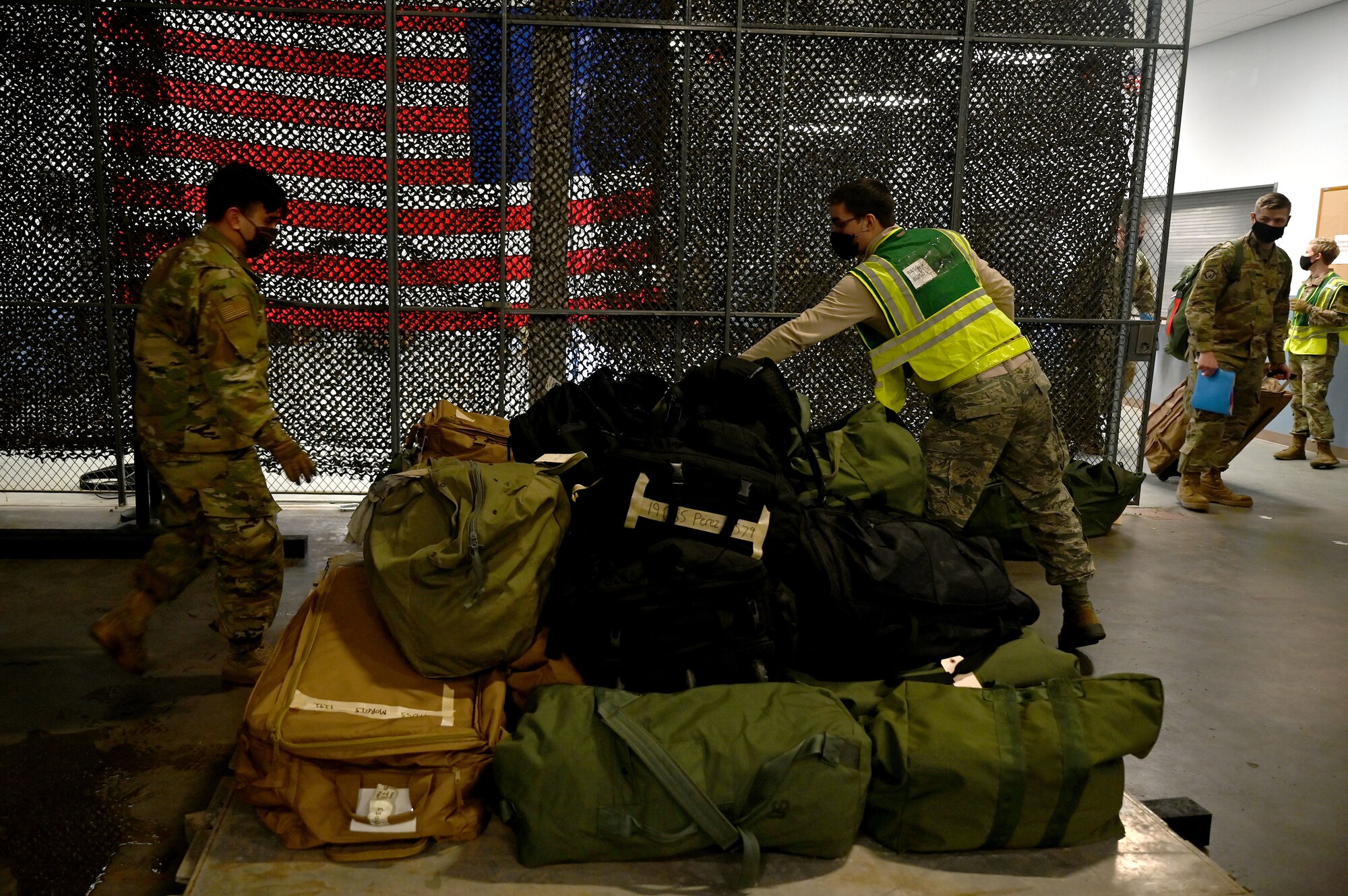 Deployment bags are stacked prior to being loaded onto an aircraft