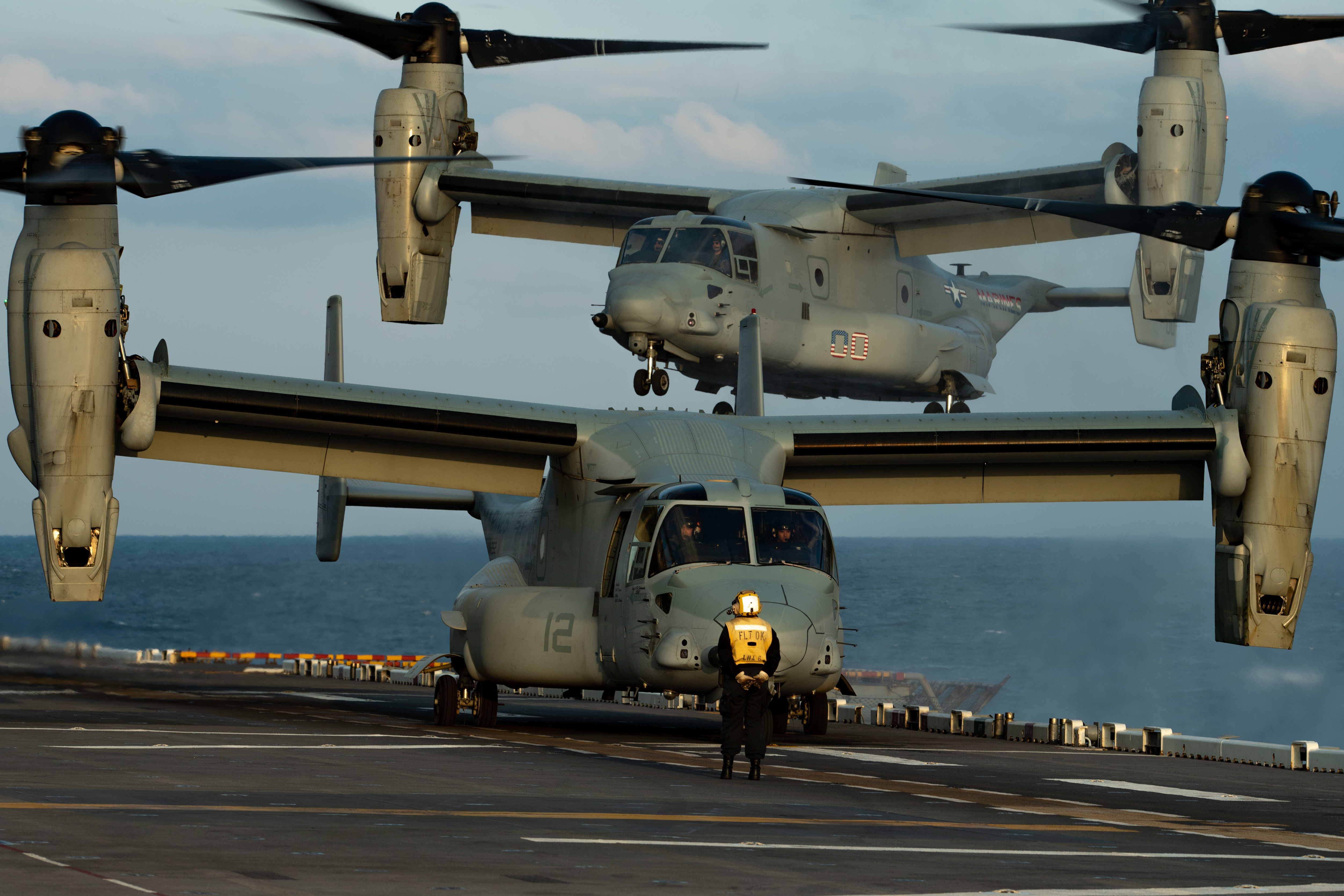 An MV-22B Osprey assigned to the 31st Marine Expeditionary Unit (MEU) lands on the flight deck of the forward-deployed amphibious assault ship USS America (LHA 6).