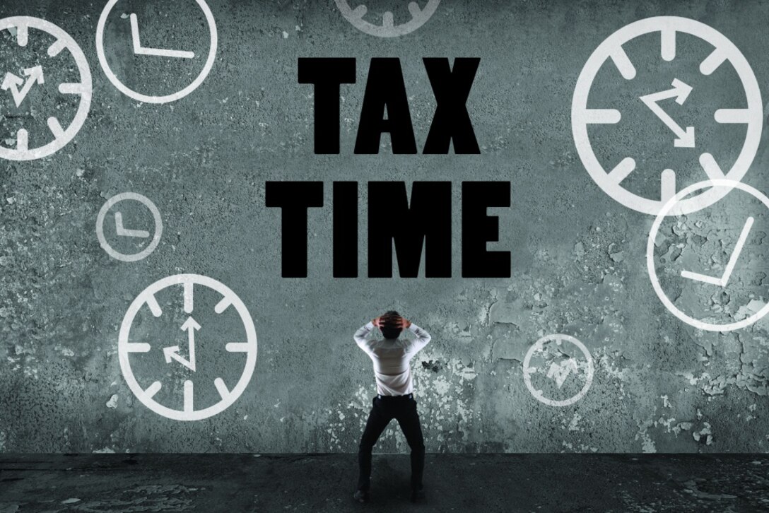 A graphic shows a man holding his head as he looks up at a large sign saying tax time.