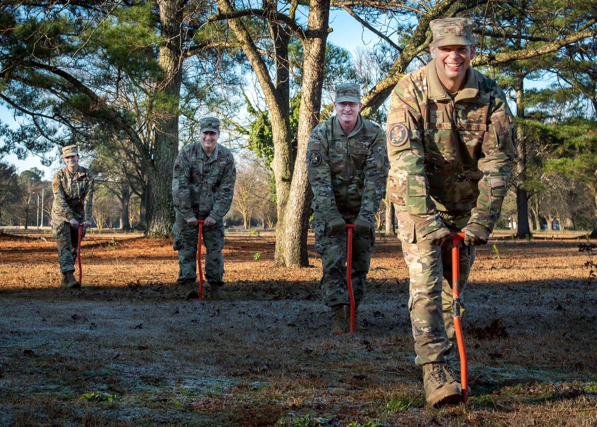 Col. Anthony Mullinax, 4th Mission Support Group commander (right), Chief Master Sgt. Shad Lochner, Mission Support Group command chief, Major Ted Ordeals, 4th Civil Engineer Squadron operation flight commander, 2nd Lieutenant Alice Cochran, 4th CES infrastructure optimization engineer, dig holes prior to planting trees at Seymour Johnson Air Force Base, North Carolina, Jan. 13, 2021.