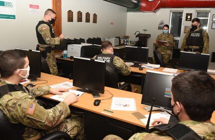 Staff Sgt. Katie Cimmino conducts a guardmount briefing during a 172nd Law Enforcement Detachment training exercise Jan. 16, 2021, at the Camp Ethan Allen Training Site in Jericho, Vermont. A team with 1st Army's 2-315th Brigade Engineer Battalion evaluated detachment Soldiers on their performance of tasks they will need when they deploy to support U.S. Army Europe. (U.S. Army National Guard photo by Don Branum)