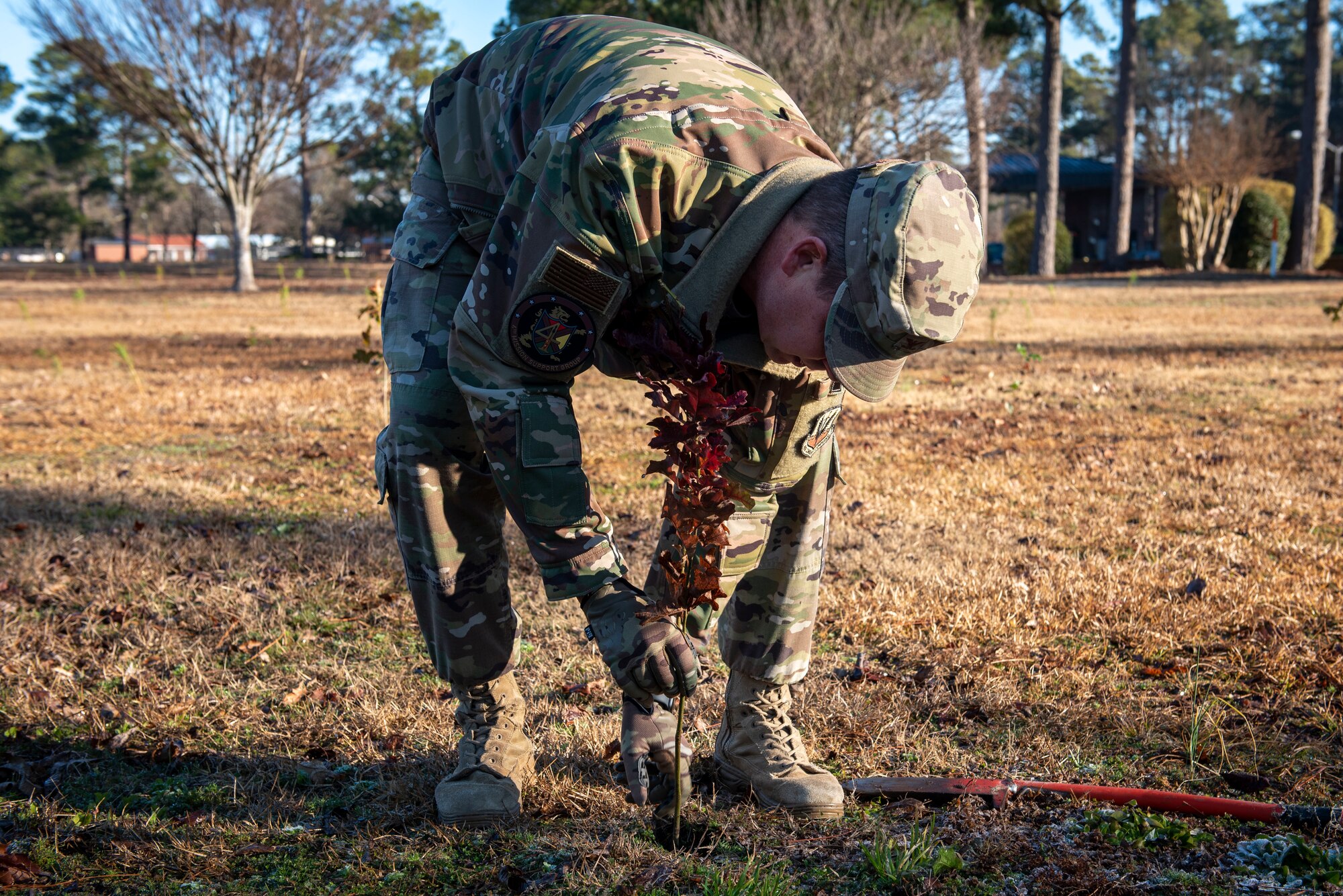 Col. Anthony Mullinax, 4th Mission Support Group commander, plants a tree at Seymour Johnson Air Force Base, North Carolina, Jan. 13, 2021.