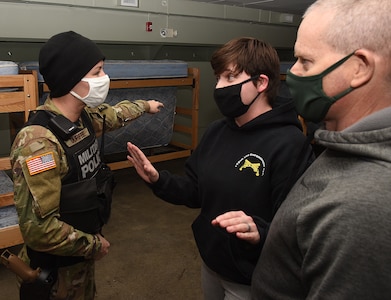 Sgt. Katelyn Durfee attempts to break up an argument during a training exercise at the Camp Ethan Allen Training Site in Jericho, Vermont, on Jan. 16, 2021. Soldiers with the 172nd Law Enforcement Detachment were evaluated on handling domestic disturbances as well as conducting traffic stops and investigating criminal activity. (U.S. Army National Guard photo by Don Branum)
