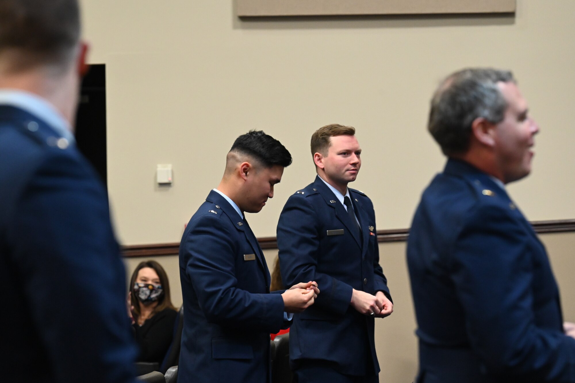 Graduated students from Specialized Undergraduate Pilot Training class 21-04, hold their freshly broken wings, Jan. 15, 2020, on Columbus Air Force Base, Miss. Fifteen officers were awarded their silver wings at the ceremony and gained the title of “Air Force Pilot”. (U.S. Air Force photo by Airman 1st Class Jessica Haynie)
