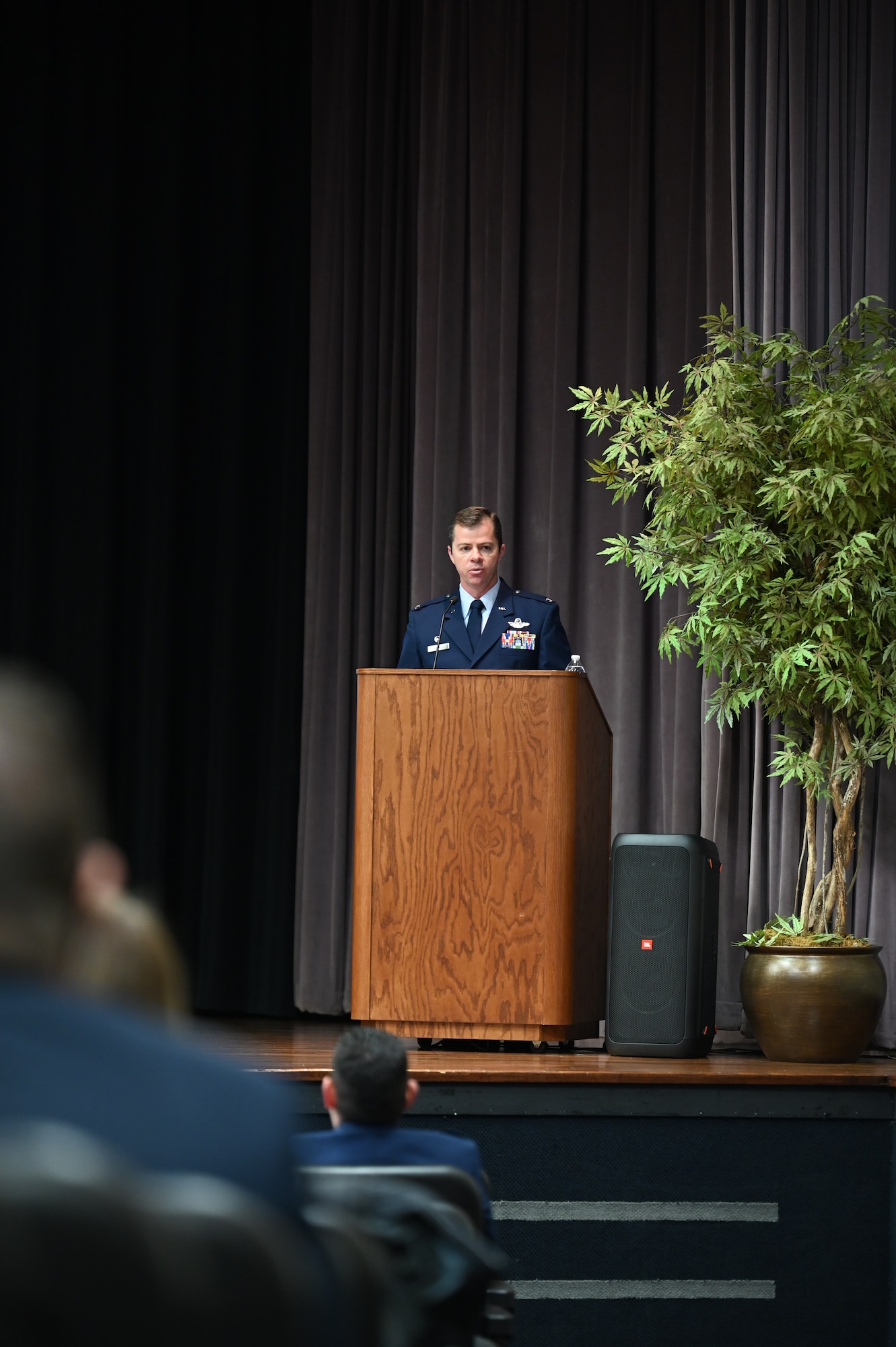 U.S. Air Force Col. James Akers, 1st Operations Group commander at Joint Base Langley-Eustis, Virginia, speaks to the Specialized Undergraduate Pilot Training class 21-04 at their graduation ceremony, Jan. 15, 2020, on Columbus Air Force Base, Miss. The 52-week training consist of six-weeks of preflight academics and physiological training followed by primary training. (U.S. Air Force photo by Airman 1st Class Jessica Haynie)
