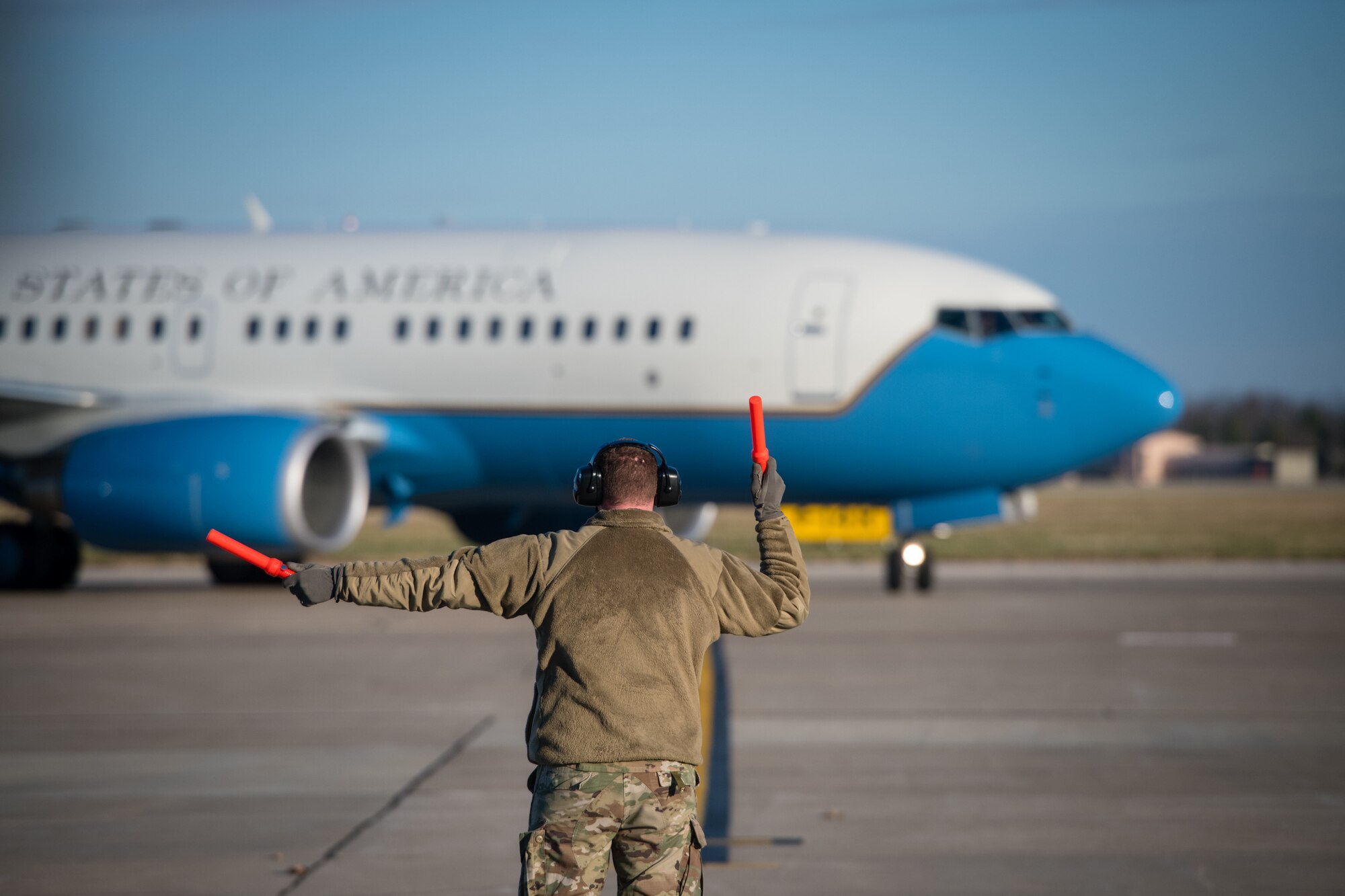 A Reserve Citizen Airmen from the 932nd  Maintenance Group marshals in a C-40C as part of the 932nd Operations Support Flight change of command ceremony, December 4, 2020, Scott Air Force Base, Illinois. (U.S. Air Force photo by Christopher Parr)