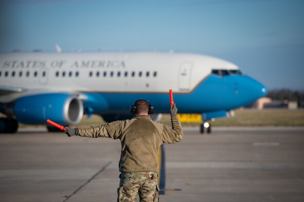 A Reserve Citizen Airmen from the 932nd  Maintenance Group marshals in a C-40C as part of the 932nd Operations Support Flight change of command ceremony, December 4, 2020, Scott Air Force Base, Illinois. (U.S. Air Force photo by Christopher Parr)