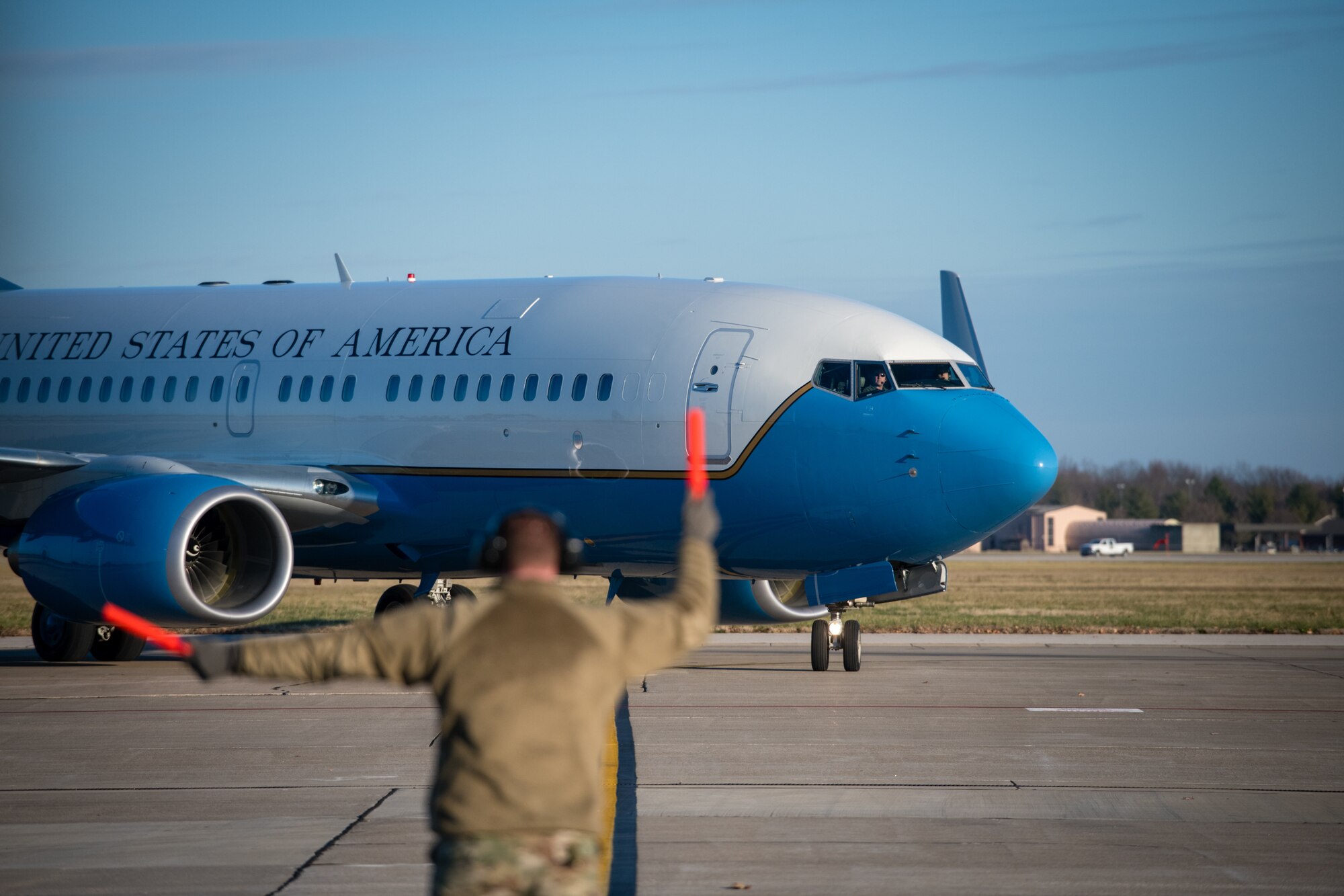 A Reserve Citizen Airmen from the 932nd  Maintenance Group marshals in a C-40C as part of the 932nd Operations Support Flight change of command ceremony, December 4, 2020, Scott Air Force Base, Illinois. (U.S. Air Force photo by Christopher Parr)