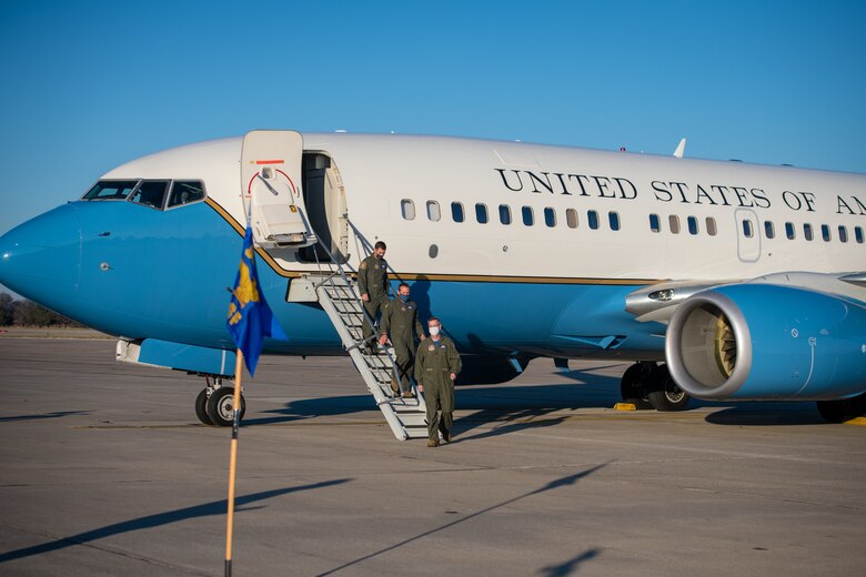 Led by 932nd Operations Group commander, Col. Mike Maloney, Lt. Col. Ryan Geilhausen, outgoing OSF commander and Lt. Col. Alan Rathjen, incoming commander, exit a C-40C as part of the 932nd Operations Support Flight change of command ceremony, December 4, 2020, Scott Air Force Base, Illinois. (U.S. Air Force photo by Christopher Parr)