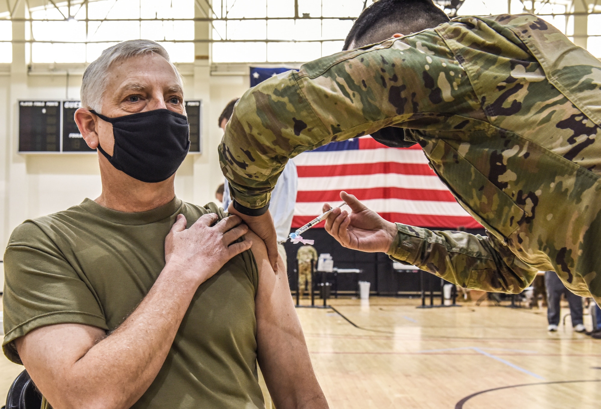 Airman receives vaccine shot.