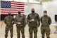 Airmen pose after receiving vaccine shot.