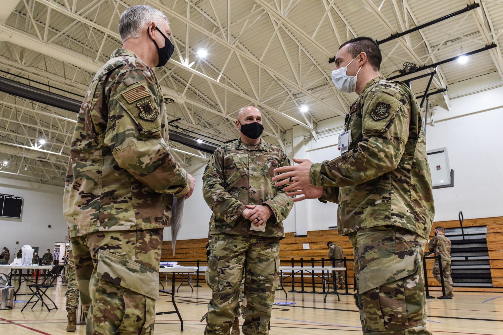 Airman briefs two individuals.