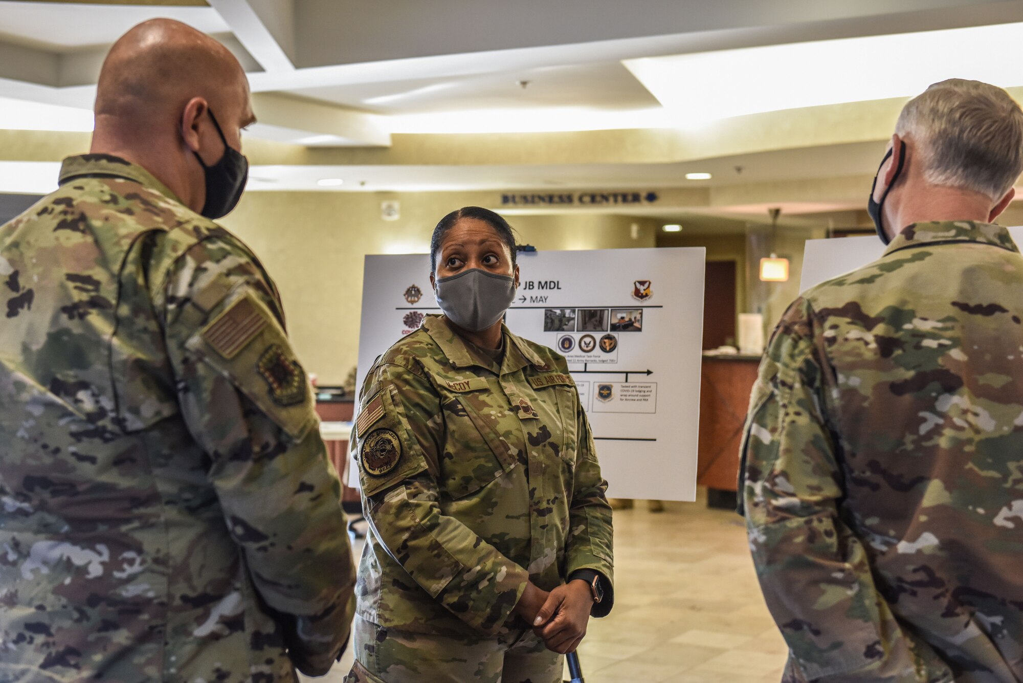 Airman briefs two individuals.