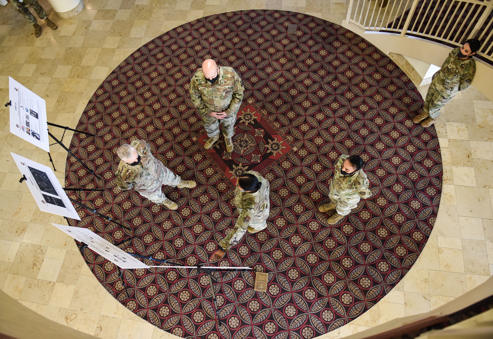 Group of Airmen talk.