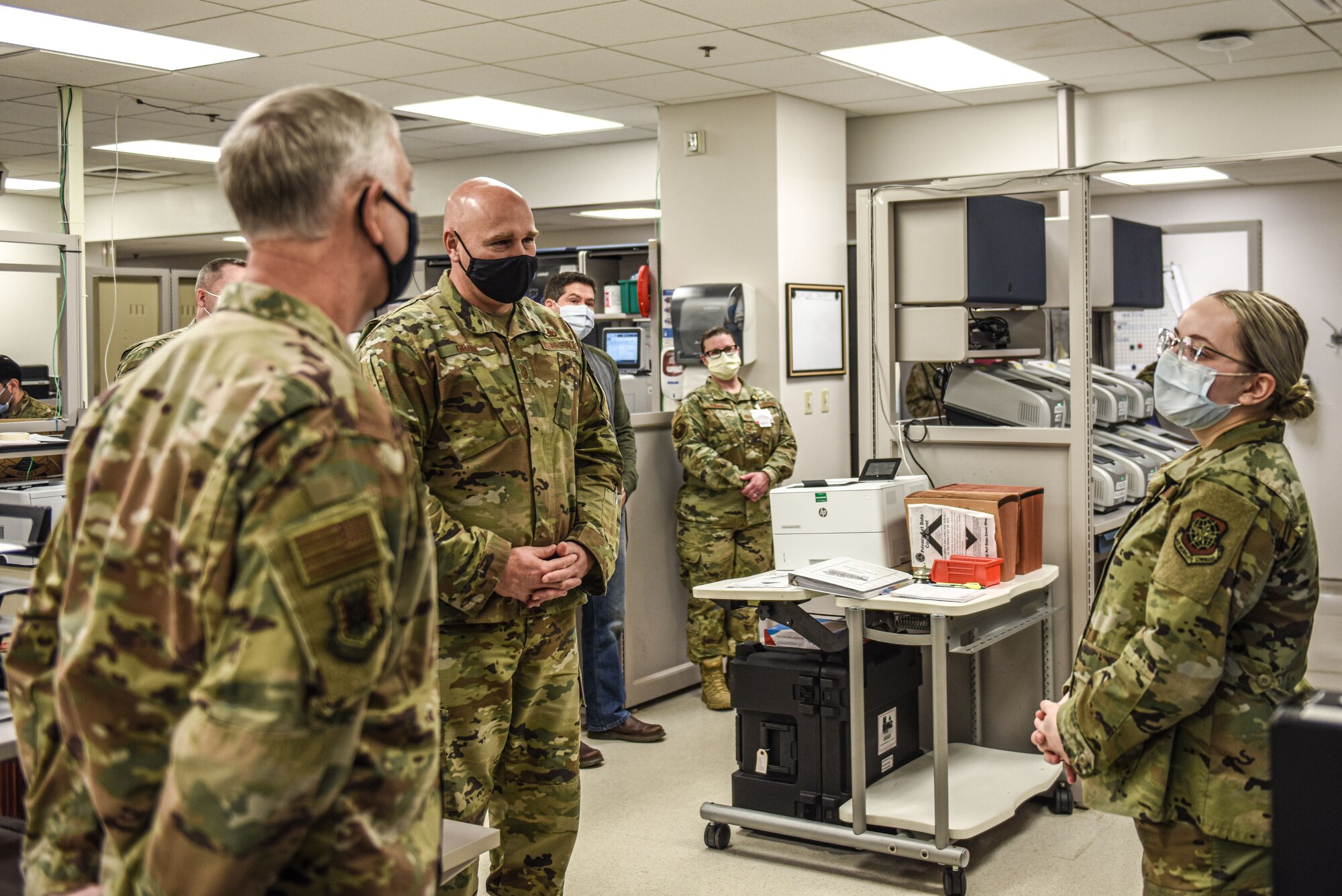 U.S. The Air Force Expeditionary Center command team is briefed on COVID-19 sample testing procedures during their visit to the 87th Air Base Wing at Joint Base McGuire-Dix-Lakehurst, New Jersey, Jan. 13, 2021. The 87th MDG lab technicians are critical in determining whether or not a patient has contracted COVID-19 by analyzing blood samples. (U.S. Air Force photo by Senior Airman Shay Stuart)