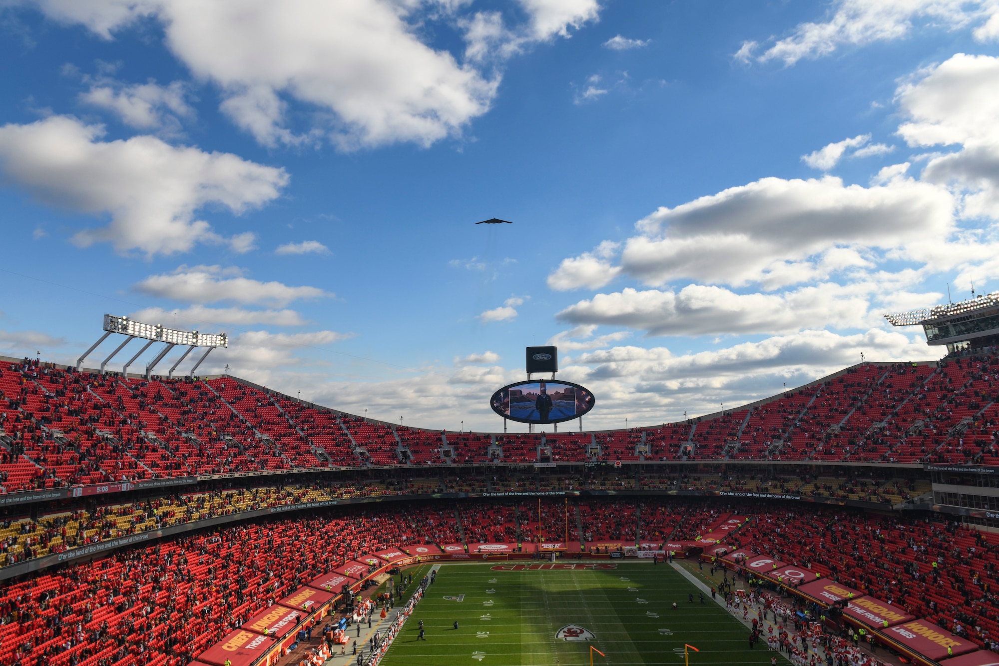 A B-2 Spirit, assigned to Whiteman Air Force Base, performs a flyover at Arrowhead Stadium during the National Anthem prior to the start of the AFC Divisional Playoffs at Arrowhead Stadium, Kansas City, Missouri, Jan. 17, 2021. The B-2 crews perform flyovers as part of regularly scheduled training flights to support community functions and government events. (U.S. Air Force photo by Tech. Sgt. Heather Salazar)