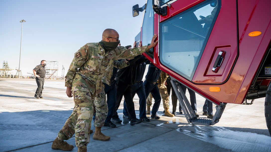 The 412th Test Wing Vice Commander, Col. Randel Gordon, and Wing Command Chief, Chief Master Sgt. Ian Eishen, joined the 812th Civil Engineer Squadron's Fire and Emergency Services Flight for a special "Push In" ceremony to officially welcome their newest Aircraft Rescue Fire Fighting (ARFF) vehicle at Edwards Air Force Base, California, Jan. 14. (Air Force photo by Chris Dyer)